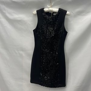 Like new. Calvin Klein Black dress with sequins. Size 4